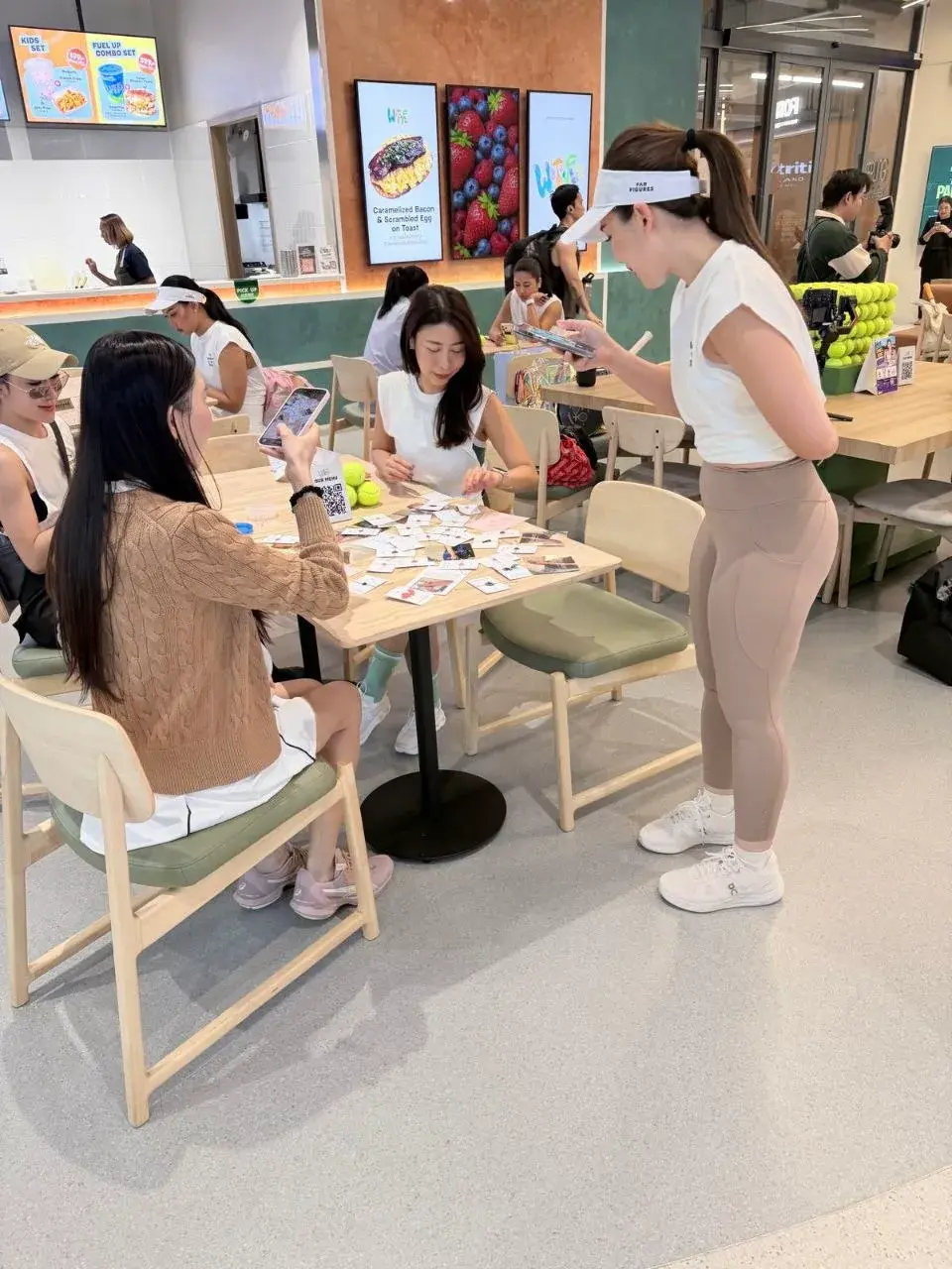 Guests sharing a relaxed conversation around a table