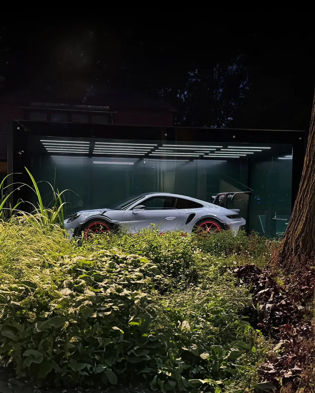 Fahrengold FG-01 garage architecture with a Porsche sports car